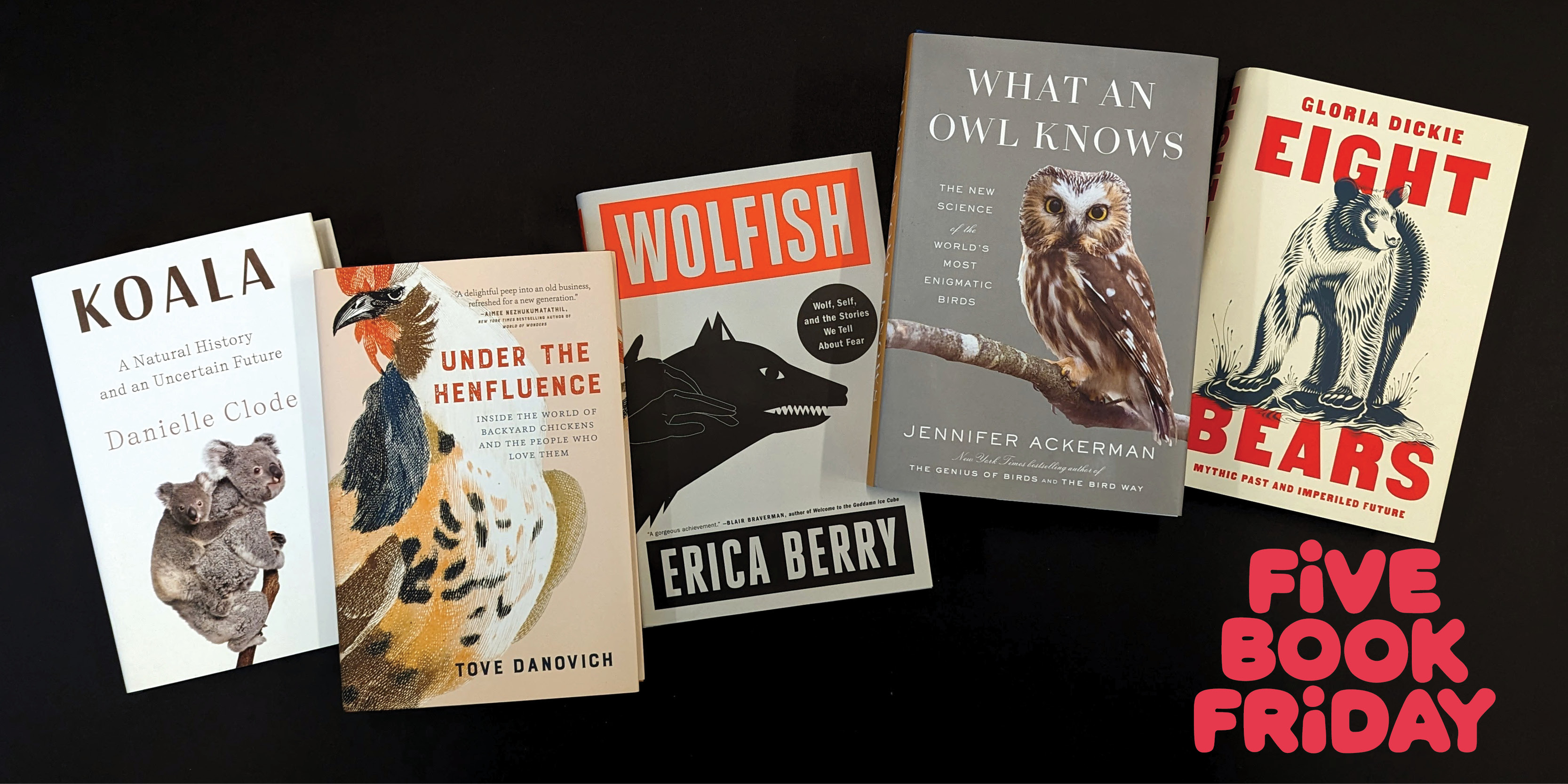 An image about five books about animals spread out on a black surface